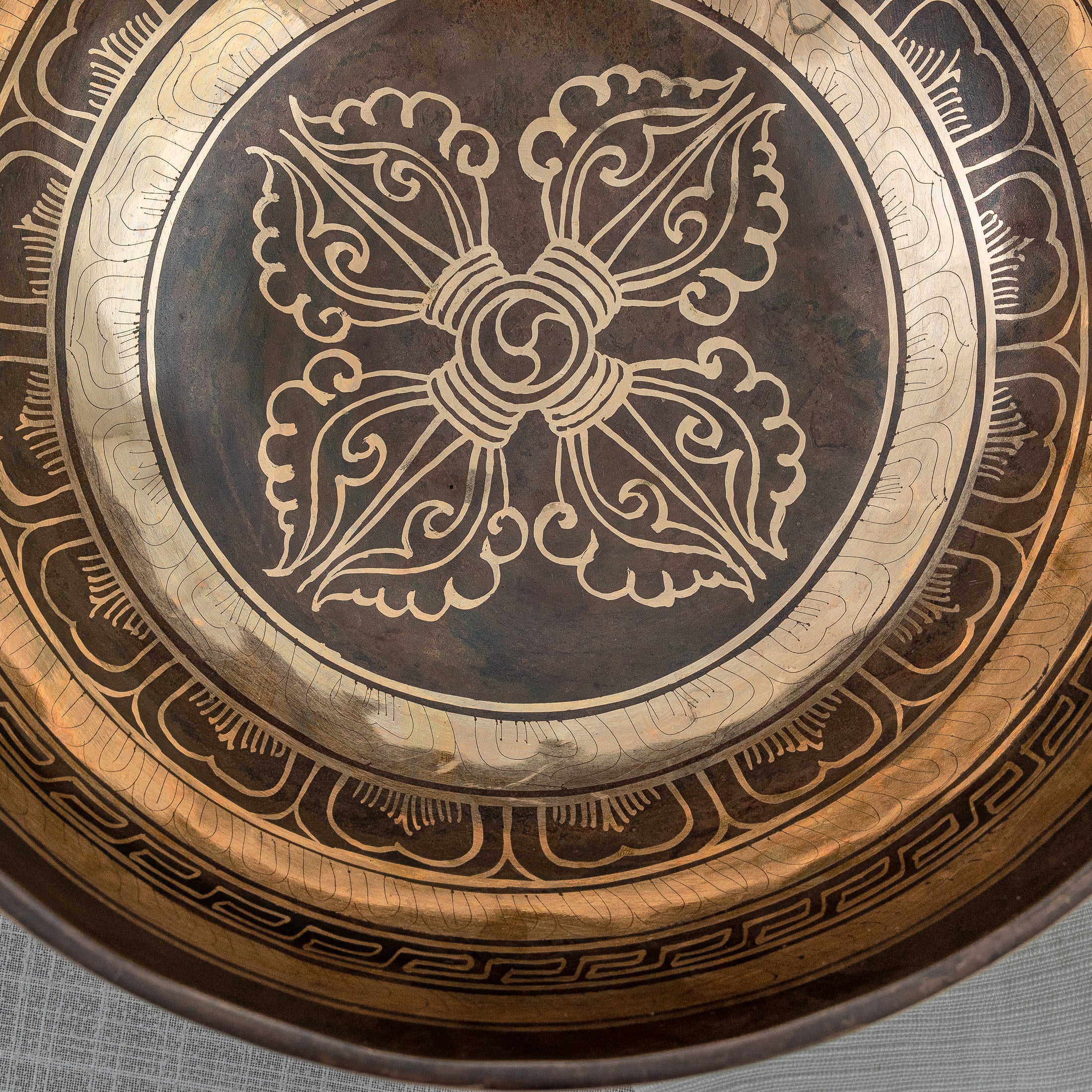 Detailed inside shot of crossed vajra singing bowl