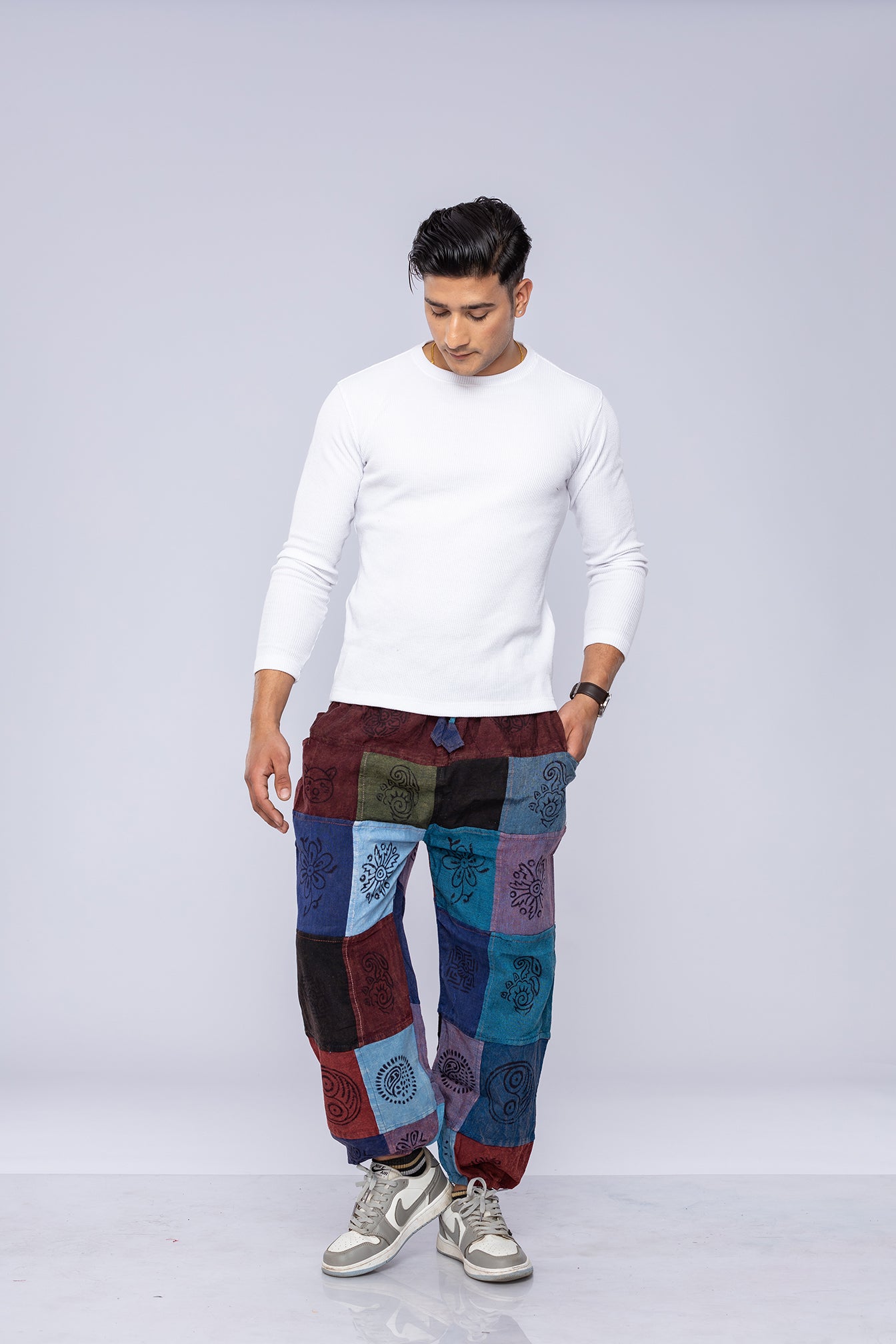 Man wearing patchwork pants