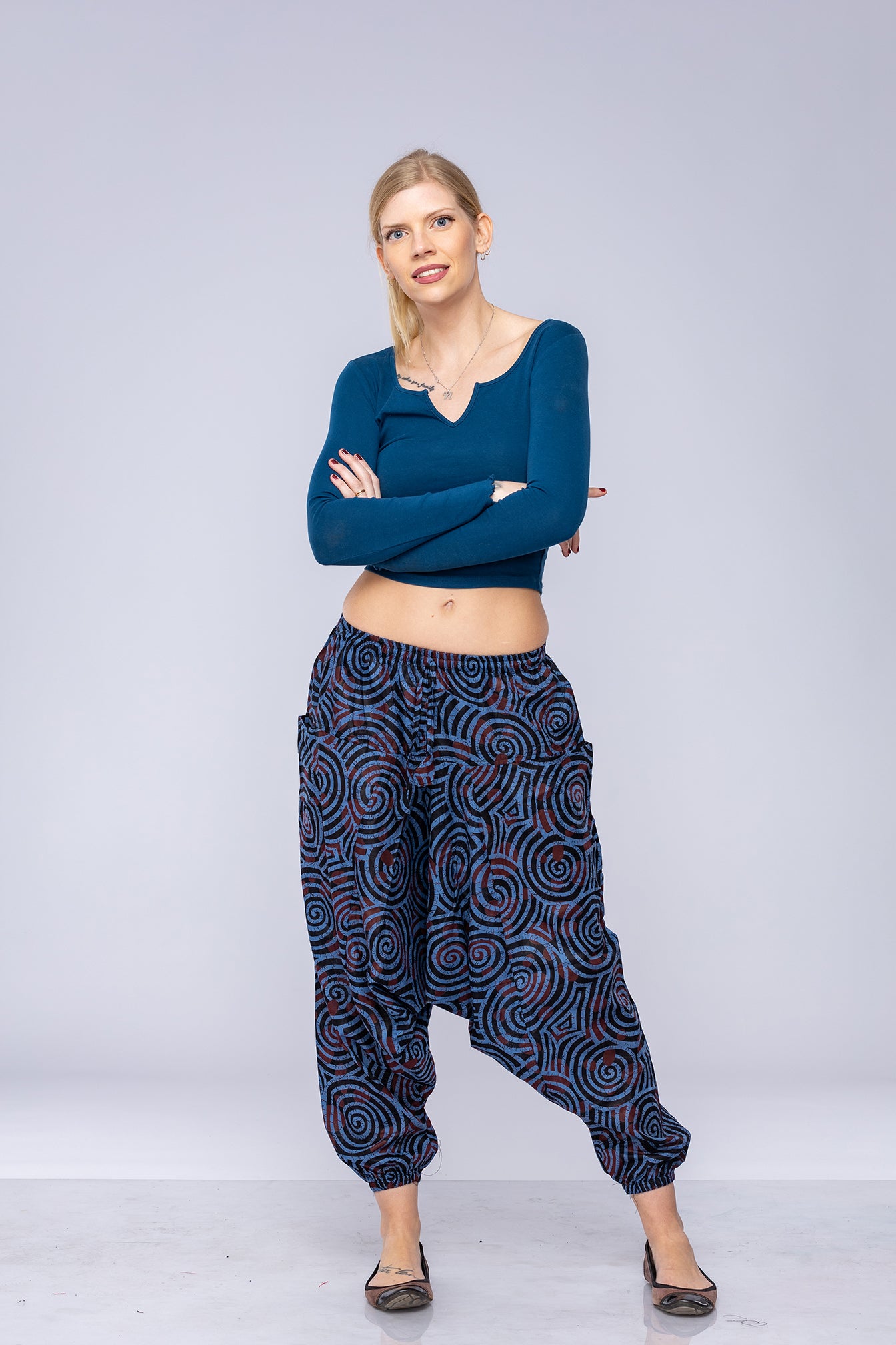 Woman wearing blue Ogee harem pants