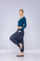 Woman wearing blue Ogee harem pants