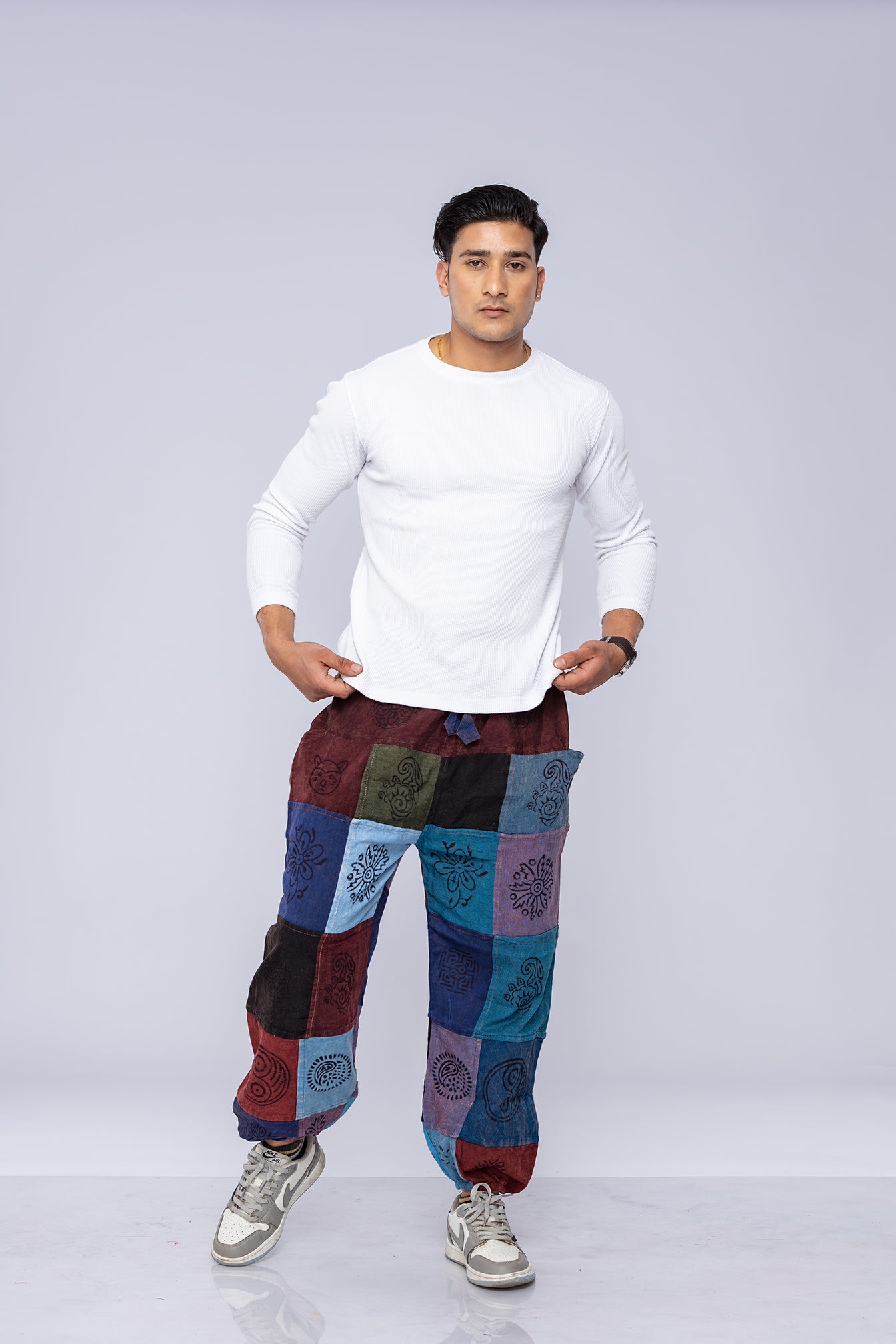 Man wearing patchwork pants