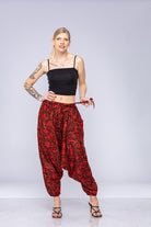 Woman wearing red Ogee harem pants