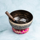 Singing bowl with mallet and cushion