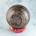 Bottom of a singing bowl with an inscription