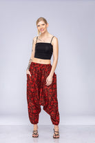 Woman wearing red Ogee harem pants