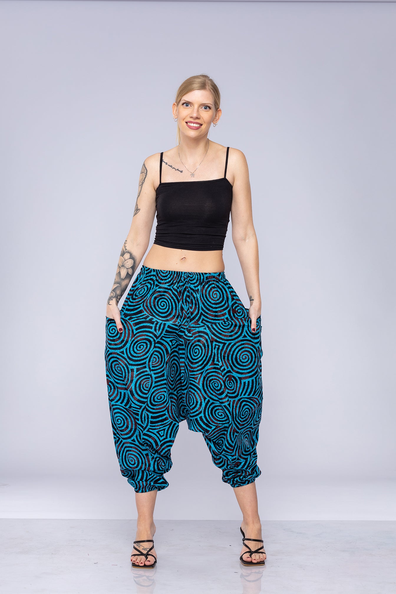 Woman wearing blue Ogee harem pants