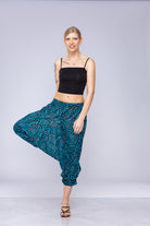 Woman wearing blue Ogee harem pants