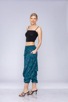 Woman wearing blue Ogee harem pants