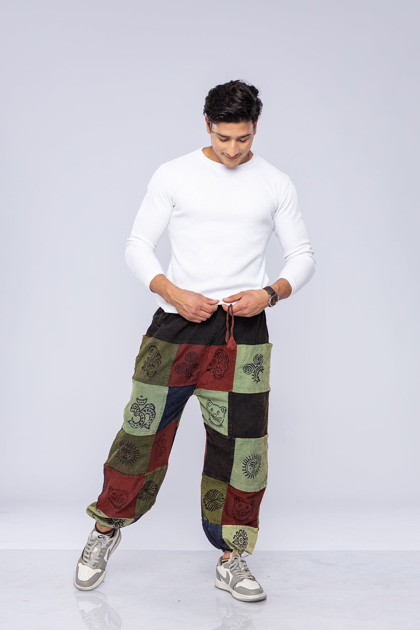 Man wearing patchwork pants