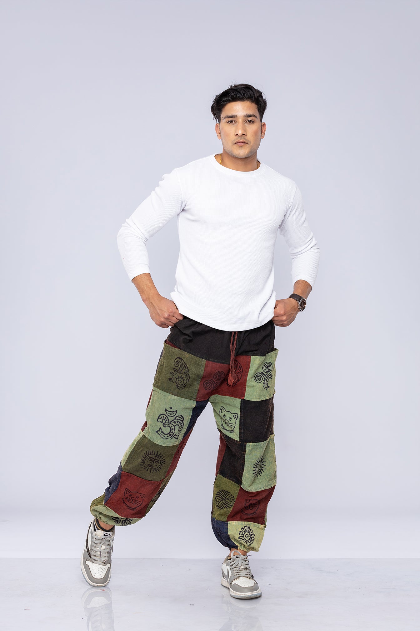 Man wearing patchwork pants