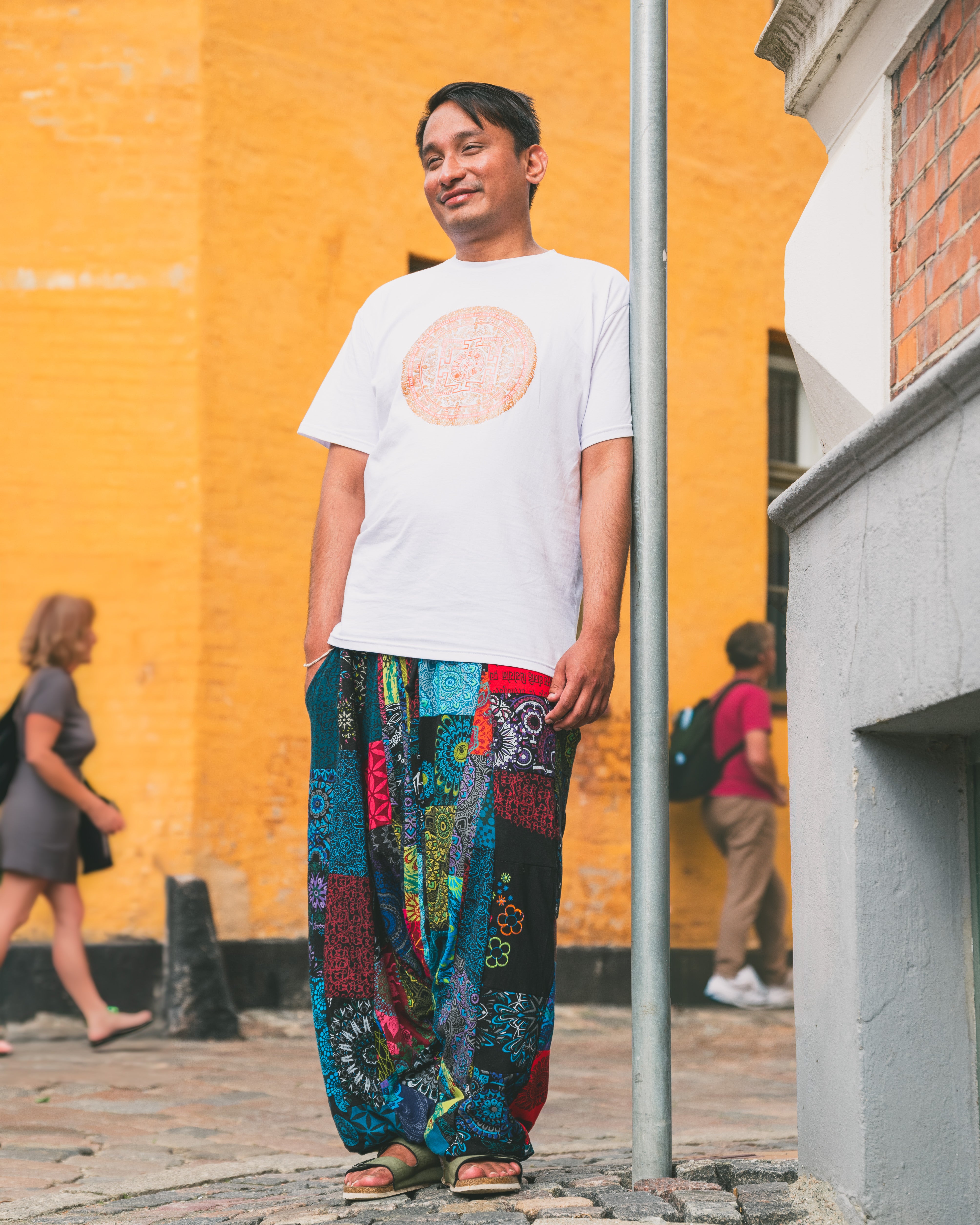 Man wearing colourful harem pants