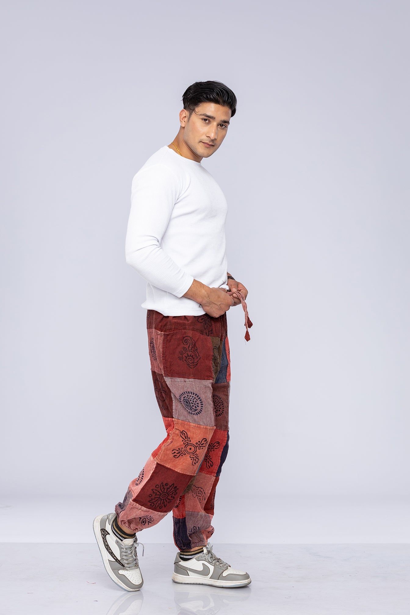 Man wearing patchwork pants