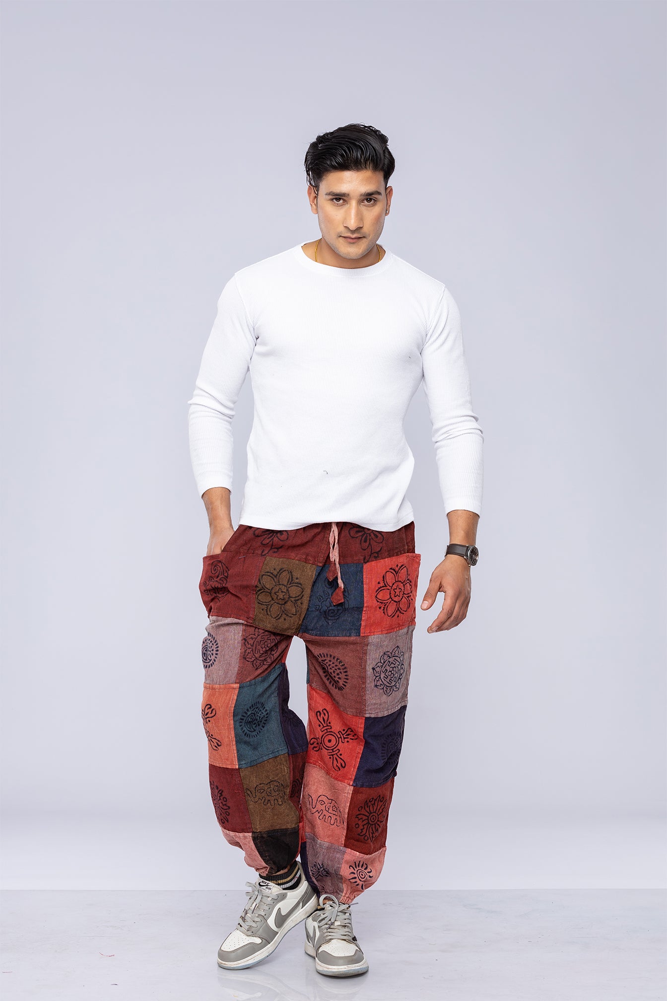 Man wearing patchwork pants