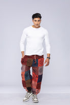 Man wearing patchwork pants