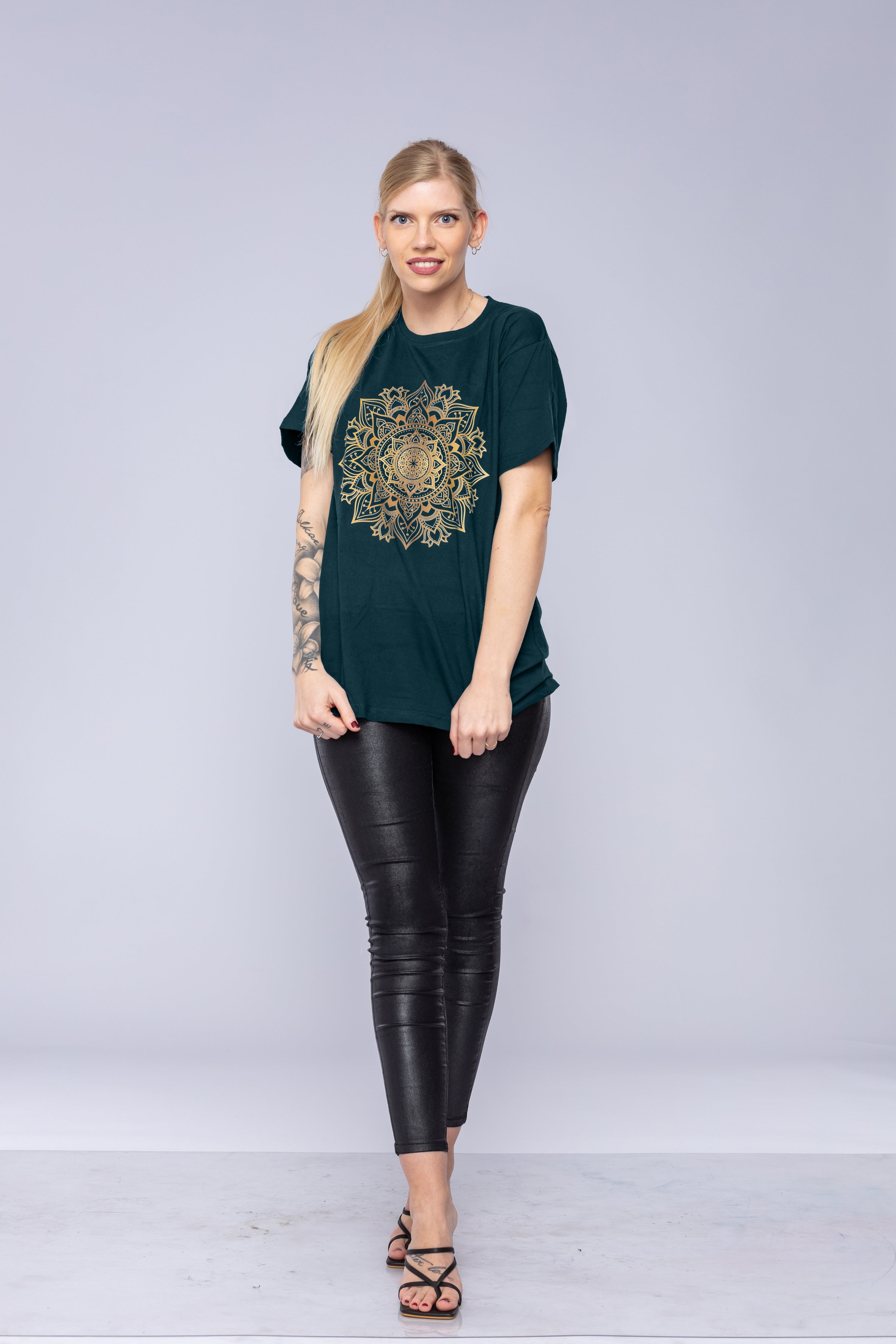 Woman wearing a green mandala t-shirt