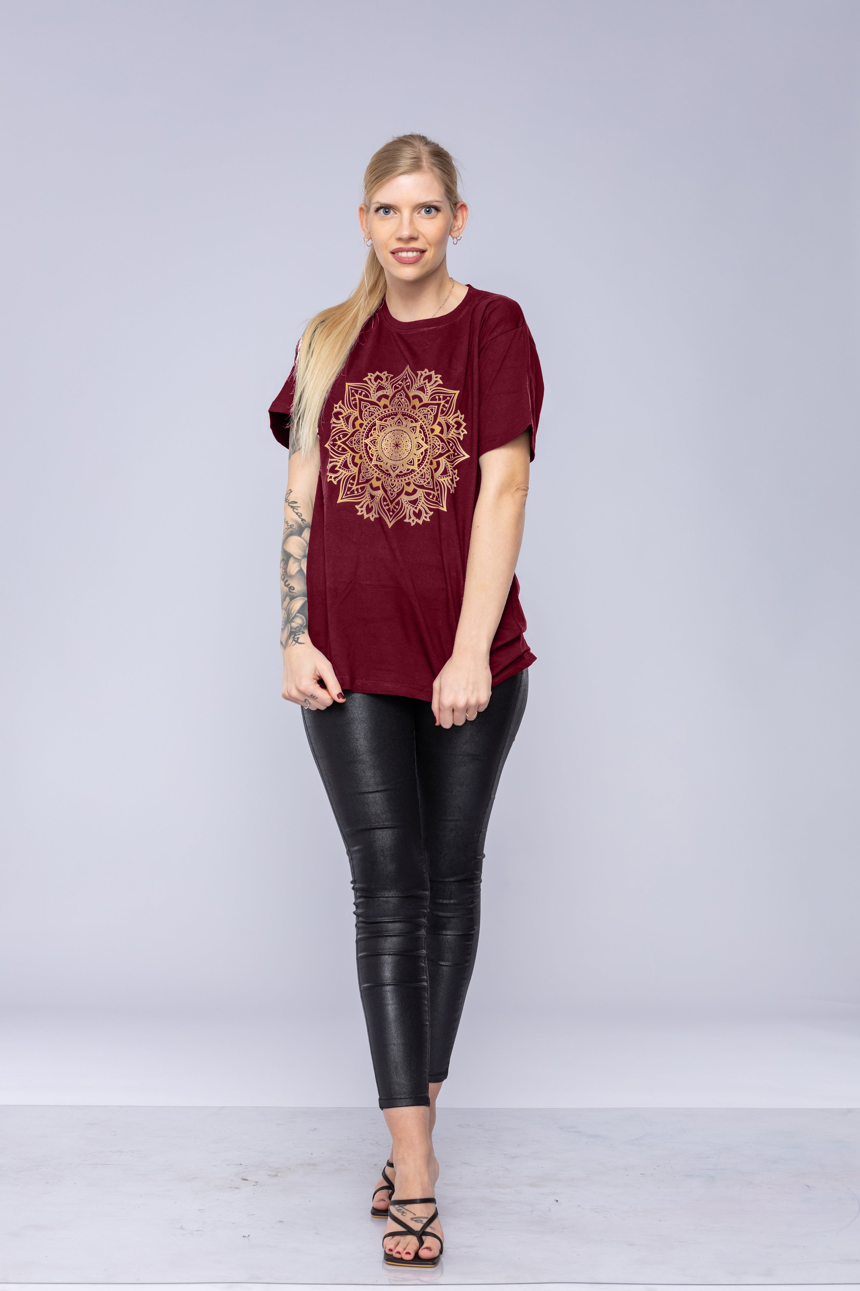 Woman wearing a red mandala t-shirt