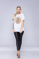 Woman wearing a white mandala t-shirt