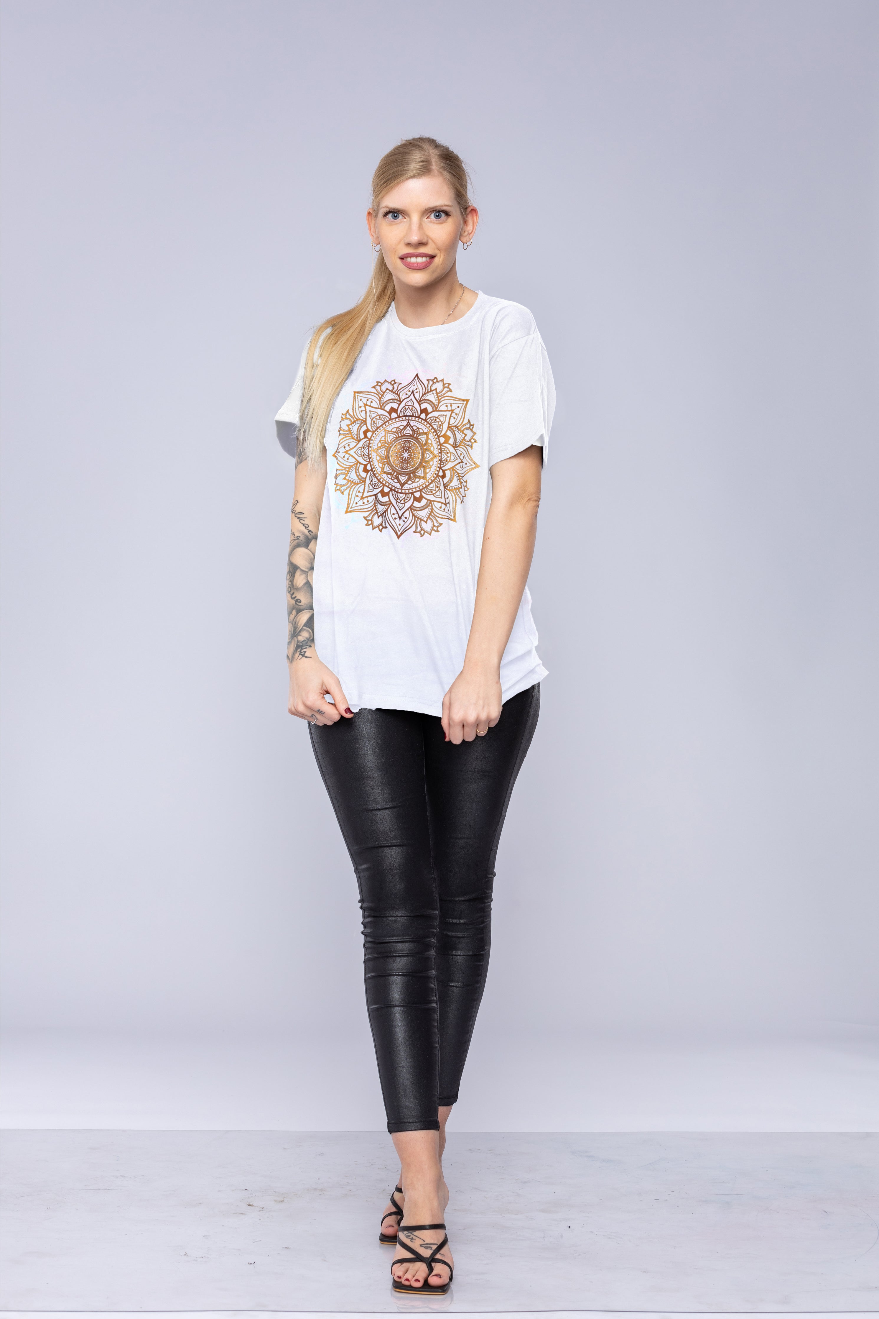 Woman wearing a white mandala t-shirt